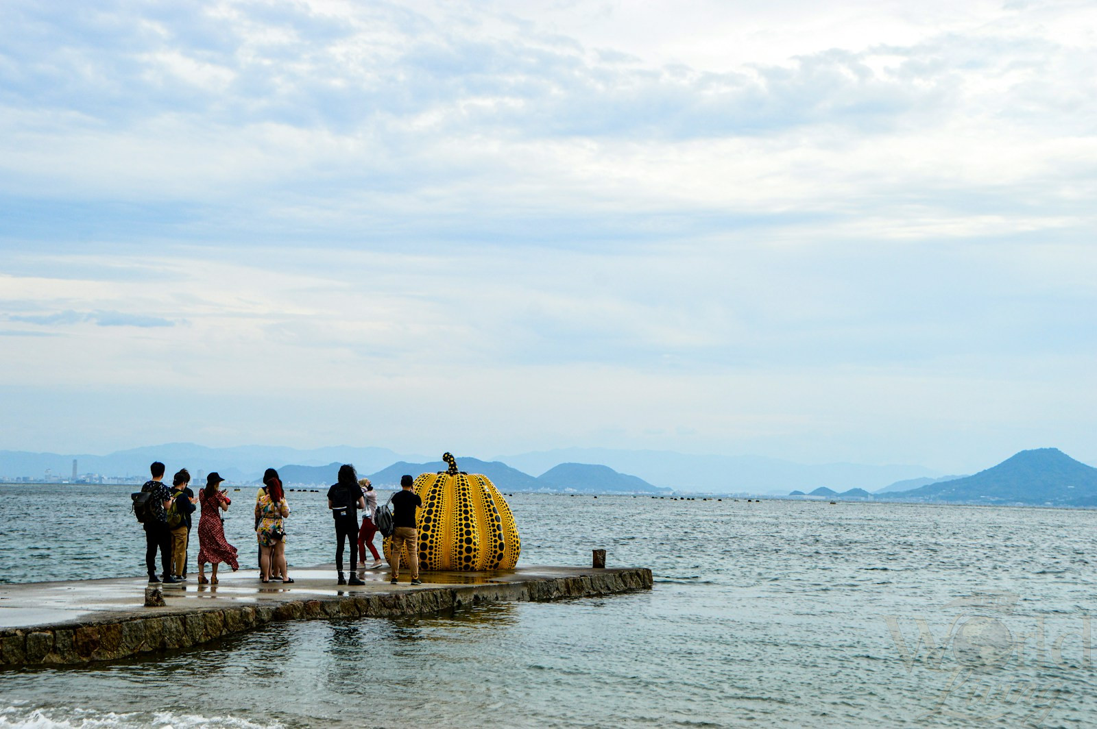 What It Really Feels Like to Experience Japan Beyond Tokyo 3 people standing on gray concrete dock during daytime