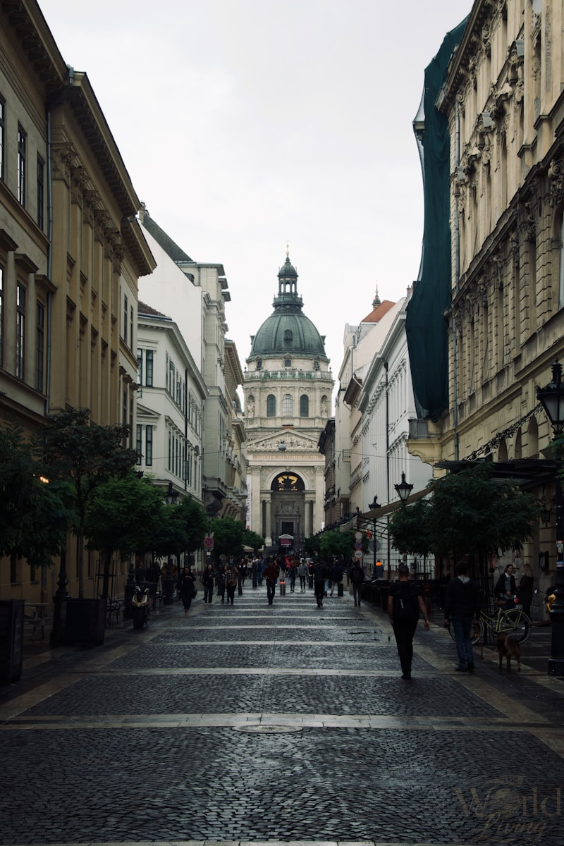 The Best Time to Travel for Lower Costs and Fewer Crowds 2 The Best Time to Travel. a city street with people walking down it.