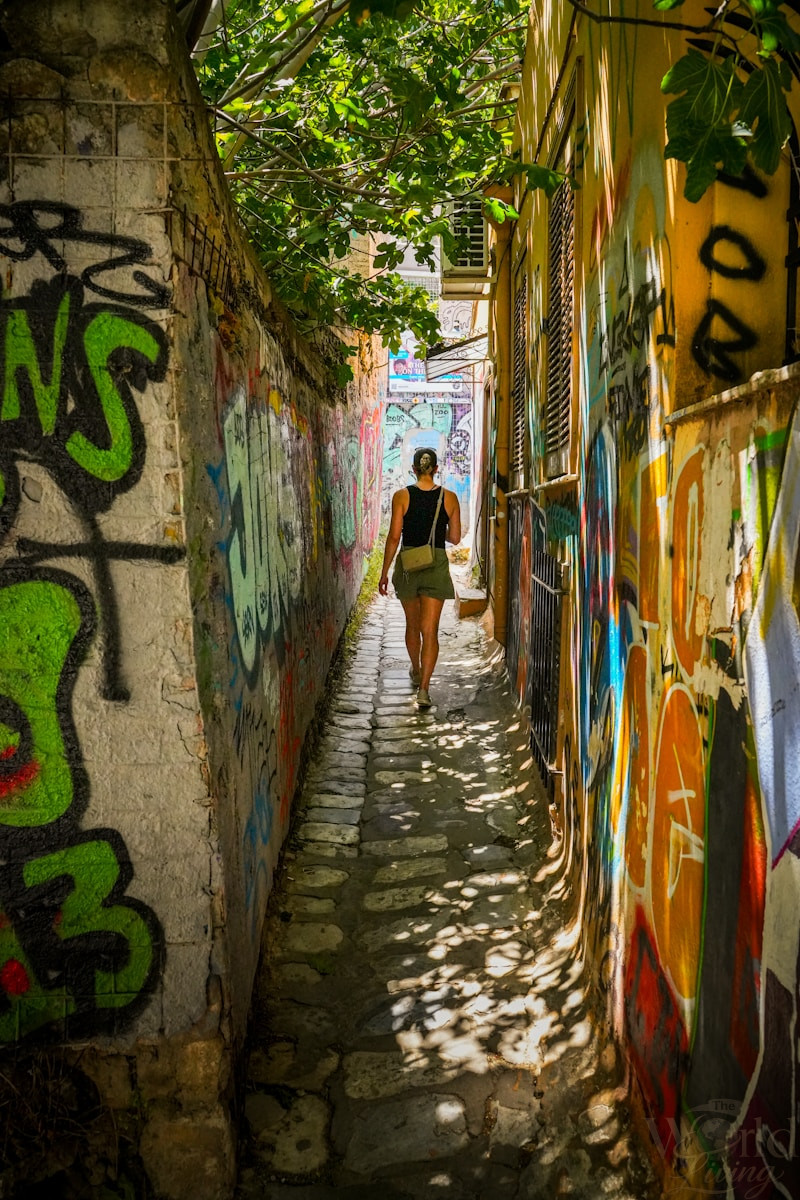 The Magic of Getting Lost While Traveling 2 Getting Lost While Traveling. Woman walking down a graffiti-covered alleyway