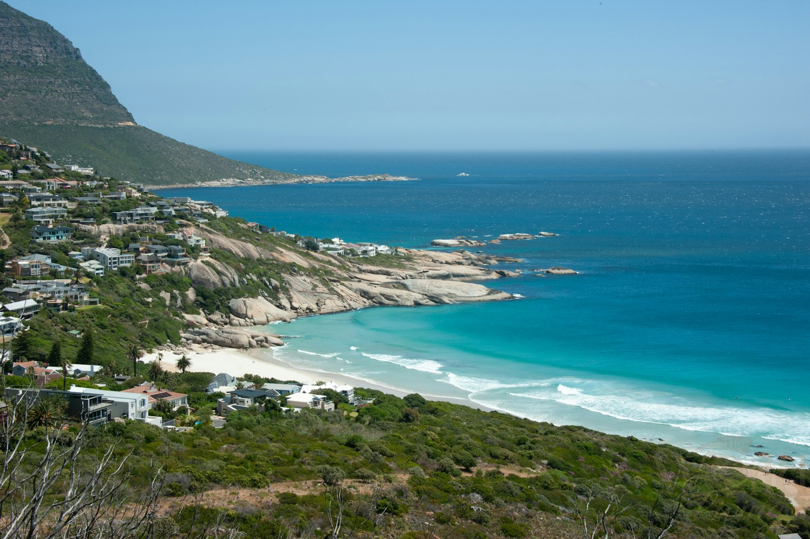 Secret Viewpoints in Cape Town Most Visitors Miss 3 Viewpoints in Cape Town. secret beach viewpoint in Cape Town at Llandudno with mountain backdrop.