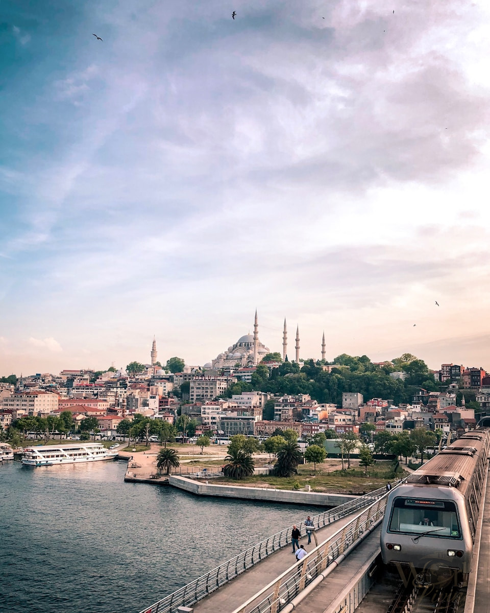 A 4-Day Istanbul Itinerary for First-Time Visitors 2 4-Day Istanbul Itinerary. Istanbul Itinerary. gray and black train traveling on top of bridge during daytime