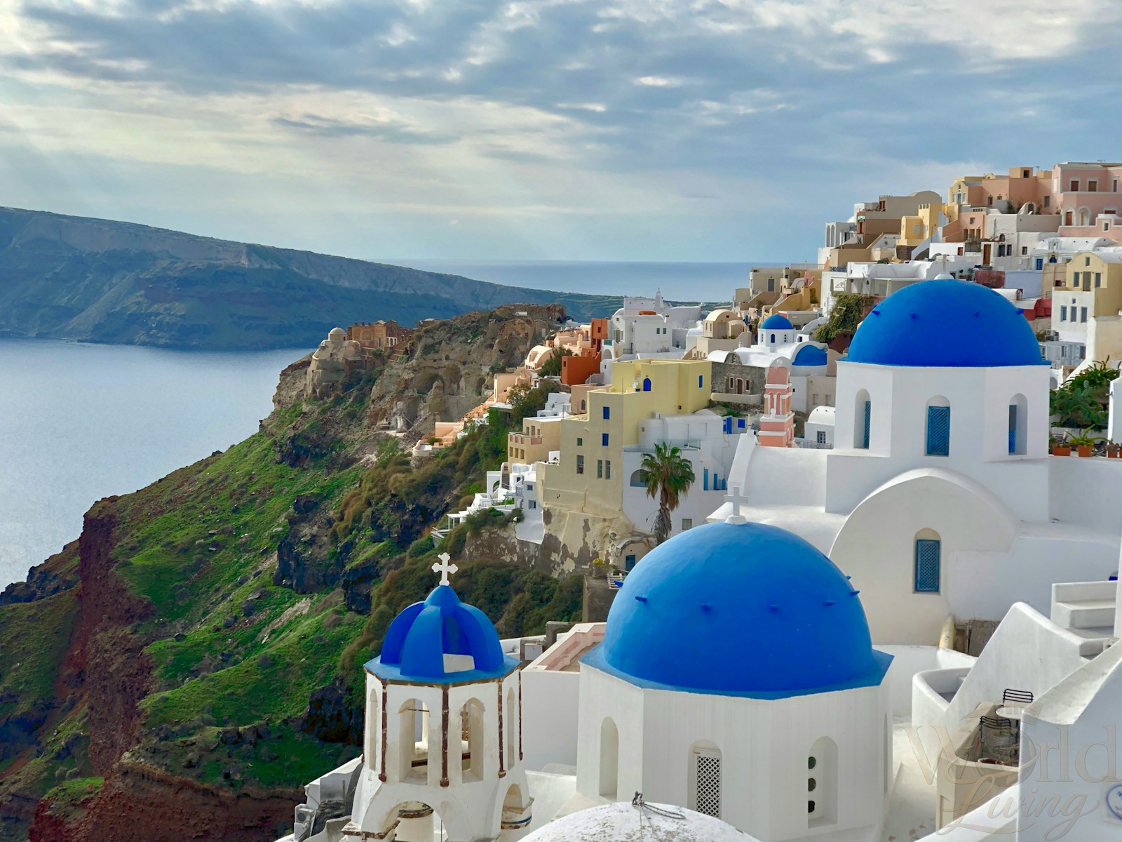 The Most Aesthetic Travel Destinations for Stunning Photos 2 Aesthetic Travel Destinations. white and blue concrete building near green mountain under white clouds during daytime